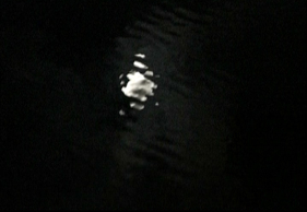 (Image 5: Light reflected on the water’s surface in the final segment of Five)